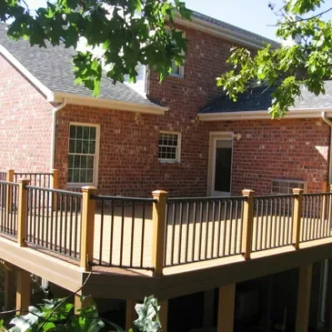 Black railing and outdoor living project by Premier Fence